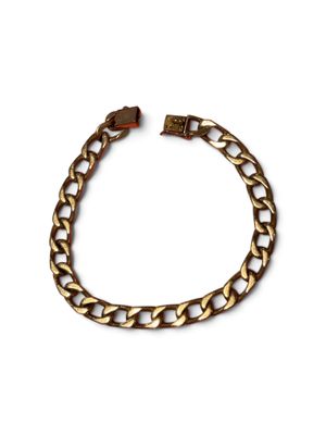 a gold chain bracelet on a white background