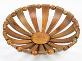 a wooden bowl that has wooden beads on it