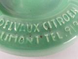 a green ashtray with the words don ' t you know? written on it