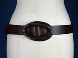 brown leather belt with a metal buckle on a mannequin torso