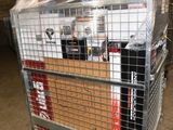 a metal cart with several boxes on it in a warehouse