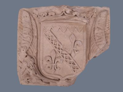 an image of a stone plaque with a coat of arms on it