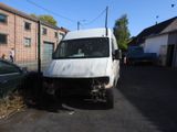 a white van that is parked on the side of the road