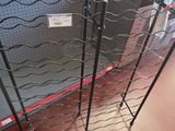 a wine rack that has a bunch of wine bottles on it