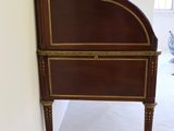 a wooden desk with a mirror on top of it