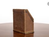 a brown box sitting on top of a wooden table