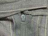 a close up of a zipper on a pair of jeans