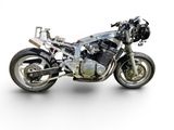 a motorcycle that is parked on a white surface
