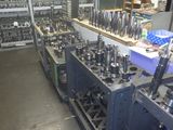 a room filled with machines and tools that are on the shelves