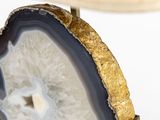 a close up of a slice of agate on a stand