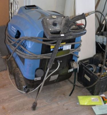 a blue machine that is sitting on the floor