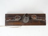 an image of a wooden object with a lamp on top of it
