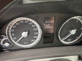 a close up of a car dashboard with various gauges and numbers