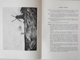 an open book with a picture of a man on skis