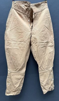 a close up of a pair of pants hanging on a wall