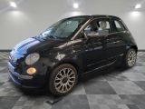 a picture of a small black car on a checkered floor
