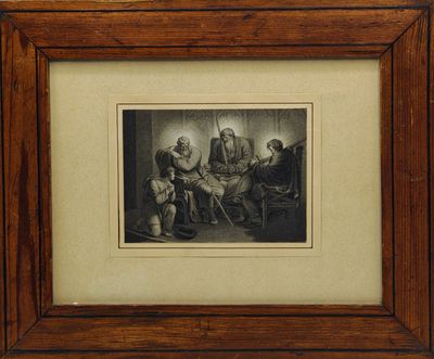 une photo encadrée représentant un groupe de personnes assises autour d'une table