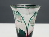 a close up of a glass vase on a table