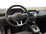 the interior of a car with a steering wheel and dashboard controls