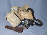 a gas mask and a pair of shoes sitting on a table
