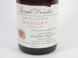 a bottle of wine that is sitting on a table