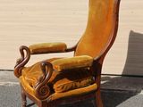 a yellow chair that is sitting in the middle of the street