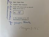an open book with a handwritten page on it sitting on top of a table