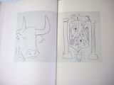 an open book with a drawing of a bull and a picture of a man