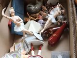 a box full of figurines sitting on a table