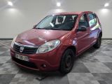 a picture of a small red car parked in a garage