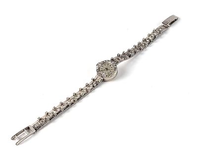 bracelet watch with crystal stones on a white background on a white surface