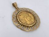a gold coin pendant with an image of a woman on it