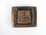a picture of a square metal object with squares in it