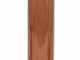 a brown glass vase sitting on a white surface