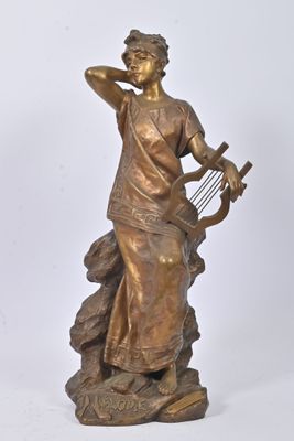 bronze statue of a woman with a harp on a rock