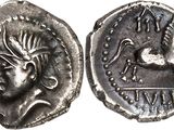 a silver coin with an image of a bird on it