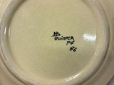 a white plate with a black writing on it