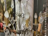 a chandelier that has a lot of glass hanging from it
