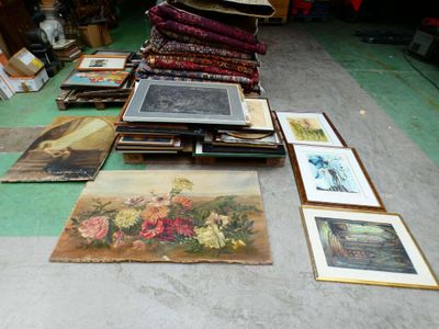 a lot of pictures on the floor in a room