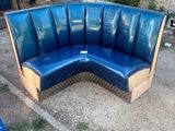 a blue bench made out of wooden pallets in a yard