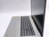 a laptop computer sitting on top of a white table