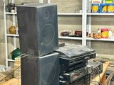 a table with a bunch of speakers on it