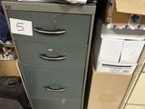 a filing cabinet with a box on top of it