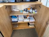 a cabinet that has a television on top of it