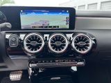 a car dashboard with a car radio and steering controls