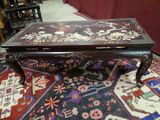 a coffee table that is on a rug on the floor