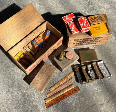 a box of cigarettes and a box of cigarettes on the ground