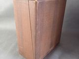 a brown suitcase that is sitting on a table
