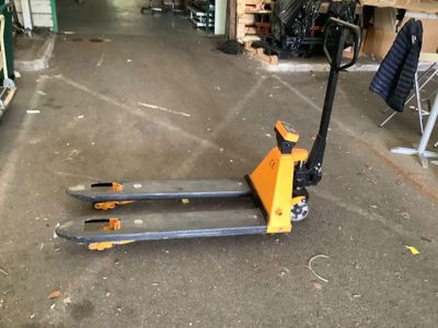 a forklift that is sitting in a garage
