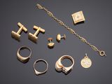 a collection of gold jewellery including rings, bracelets, and rings